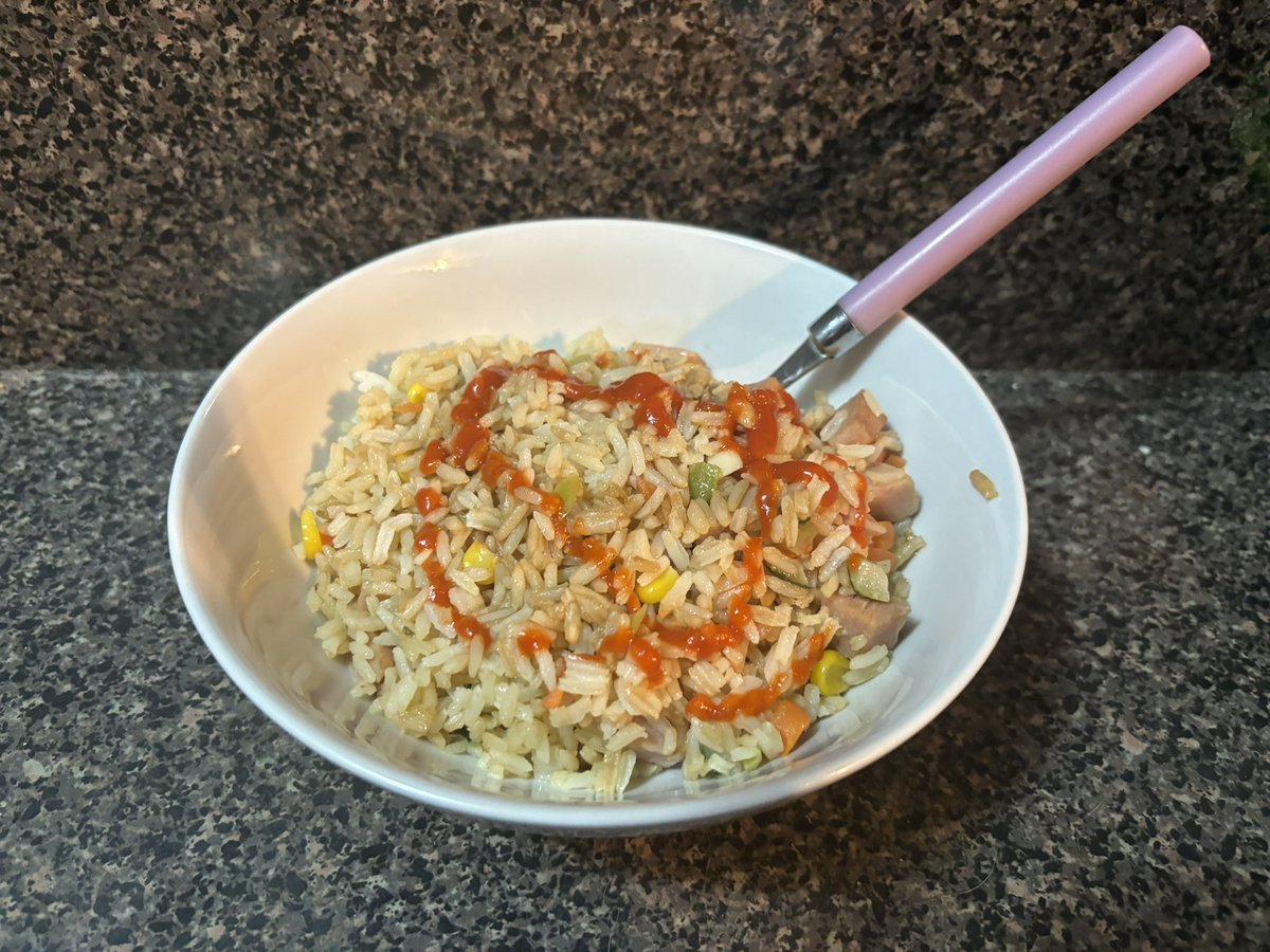 I made fried rice with spam today (my only spam recipe), garnished with sriracha. Using 1 cup rice cooked with 2 cups water &amp; half a can of spam. 
For less than $3 this makes a whole day of food at about 1250 calories. Chicken is cheaper.