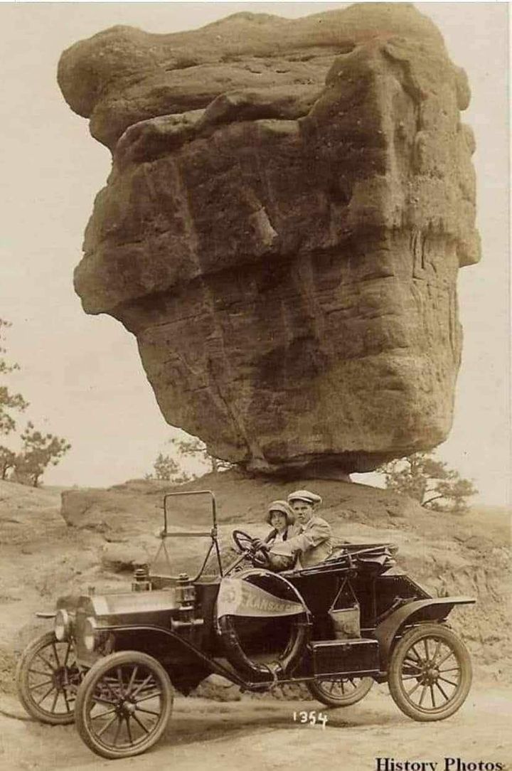 A couple touring Balanced Rock in the Garden of the Gods, Colorado Springs, Colorado, 1920.