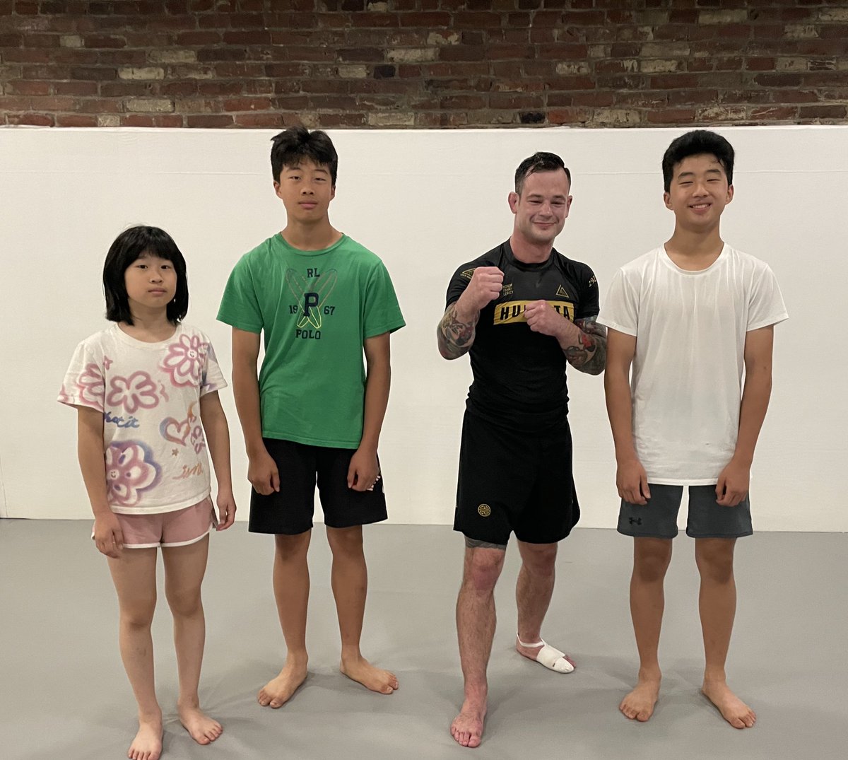 3 of my 4 kids with Professor Eli Hoobler at this morning’s “No Gi” (submission grappling) class. 7:15-8:15AM <a href="/graciephilly/">Gracie Philadelphia</a>