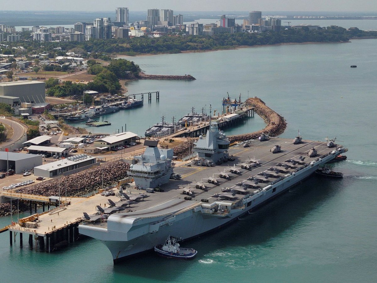 nicholadrummond's tweet image. HMS Prince of Wales in Darwin. This is a deeply impressive picture. Full complement of F-35Bs plus Merlin ASW helicopters. It has taken a long time, but we got there.