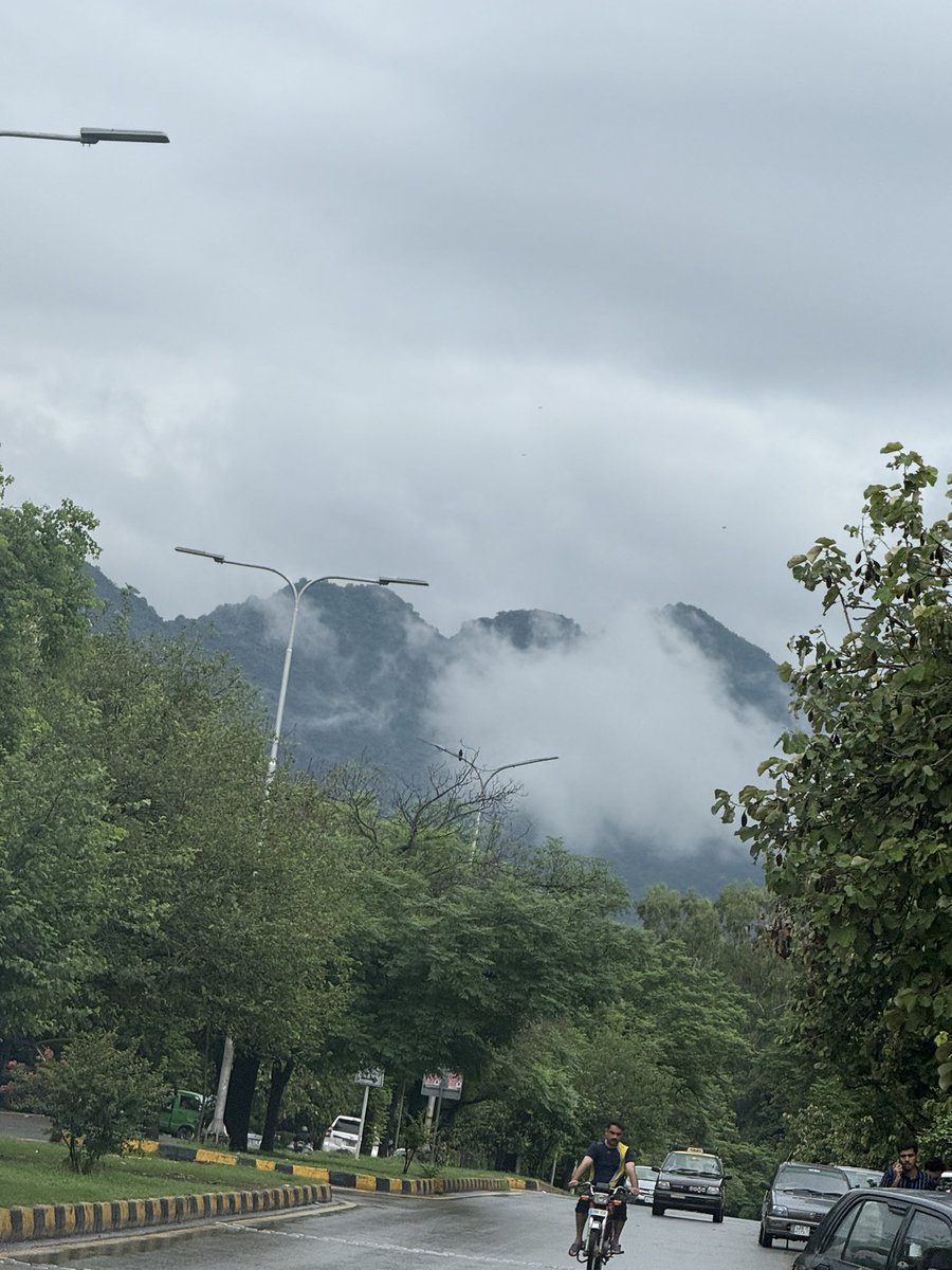 Iuciiferrr's tweet image. 🌧️✨ “Where the road meets the clouds – Islamabad wearing its monsoon magic.” 🌿🏞️