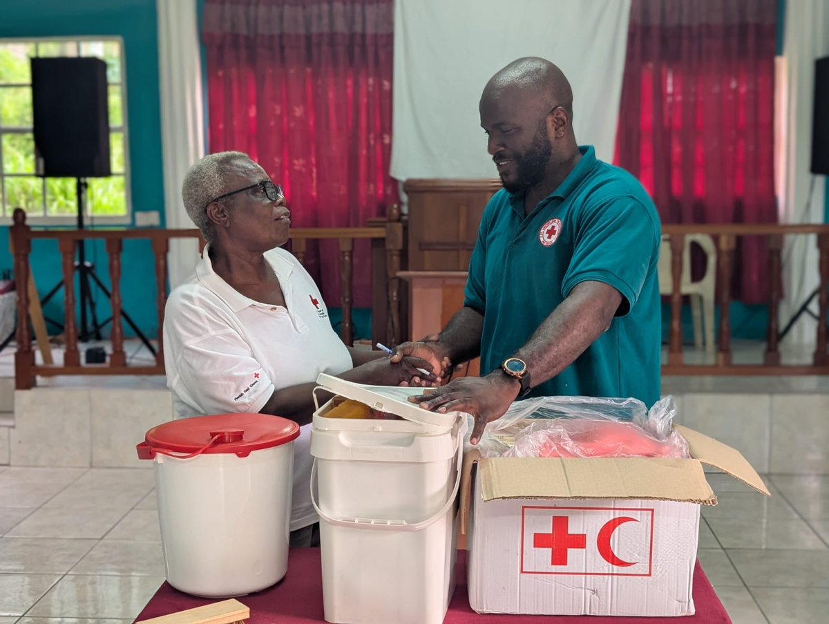 Preparation includes pre-positioning of supplies and training. WASH instructor Jerrol Laidlow is seen here with Elna Mitchell of the Fancy Red Cross group.
