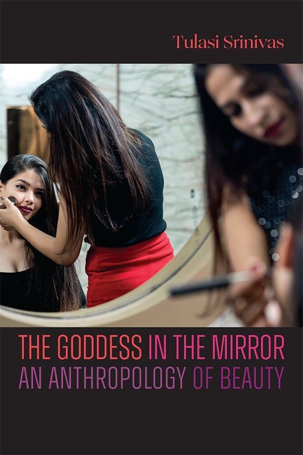 DukePress's tweet image. In "The Goddess in the Mirror," @TulasiSrinivas1 explores the dynamic and gendered world of beauty through the experiences of women in the intimate space of the contemporary Indian beauty salon. Read the intro for free now: buff.ly/BTdJH1L