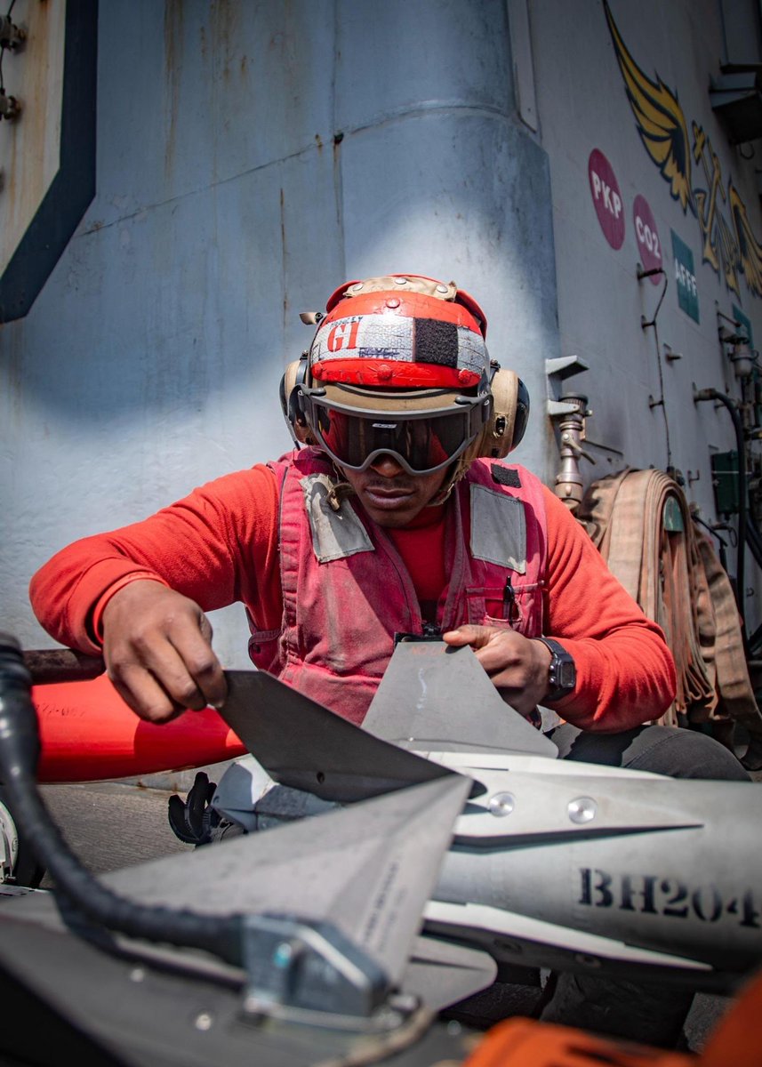 CENTCOM's tweet image. U.S. Sailors aboard the Nimitz-class aircraft carrier USS Nimitz (CVN 68) inspect, prepare, and load ordnance on an MH-60R Sea Hawk in the U.S. Central Command area of responsibility.