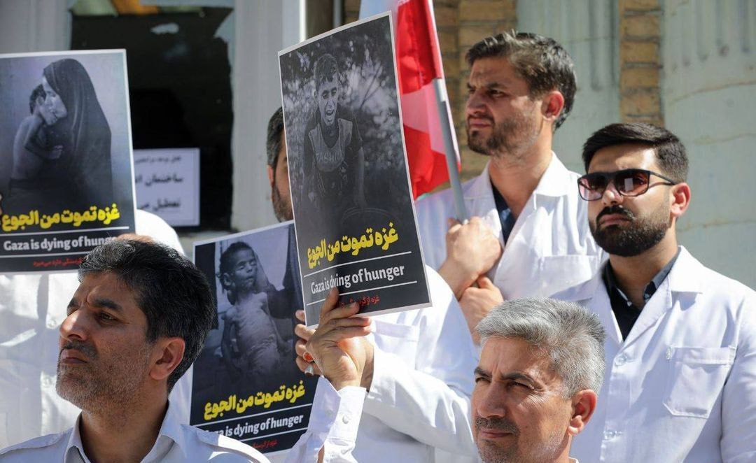 TehranTimes79's tweet image. Healthcare staff from Mashhad University of Medical held a protest outside a hospital, condemning the humanitarian crisis in Gaza.