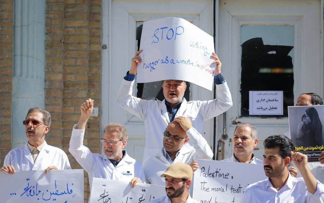 TehranTimes79's tweet image. Healthcare staff from Mashhad University of Medical held a protest outside a hospital, condemning the humanitarian crisis in Gaza.