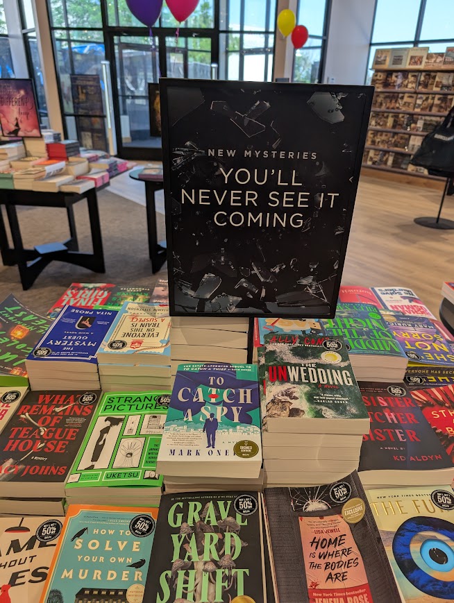 I know what the sign says, but I saw it coming... just a moment before I put my book on this table.

I also see it in your future!
amazon.com/Catch-Spy-Mark…