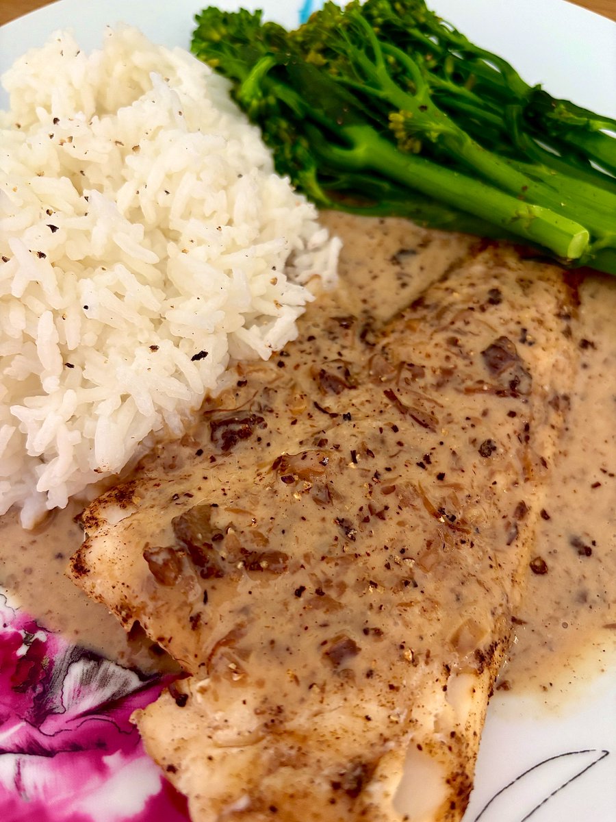 Roast cod with mushroom sauce served with rice and tenderstem broccoli