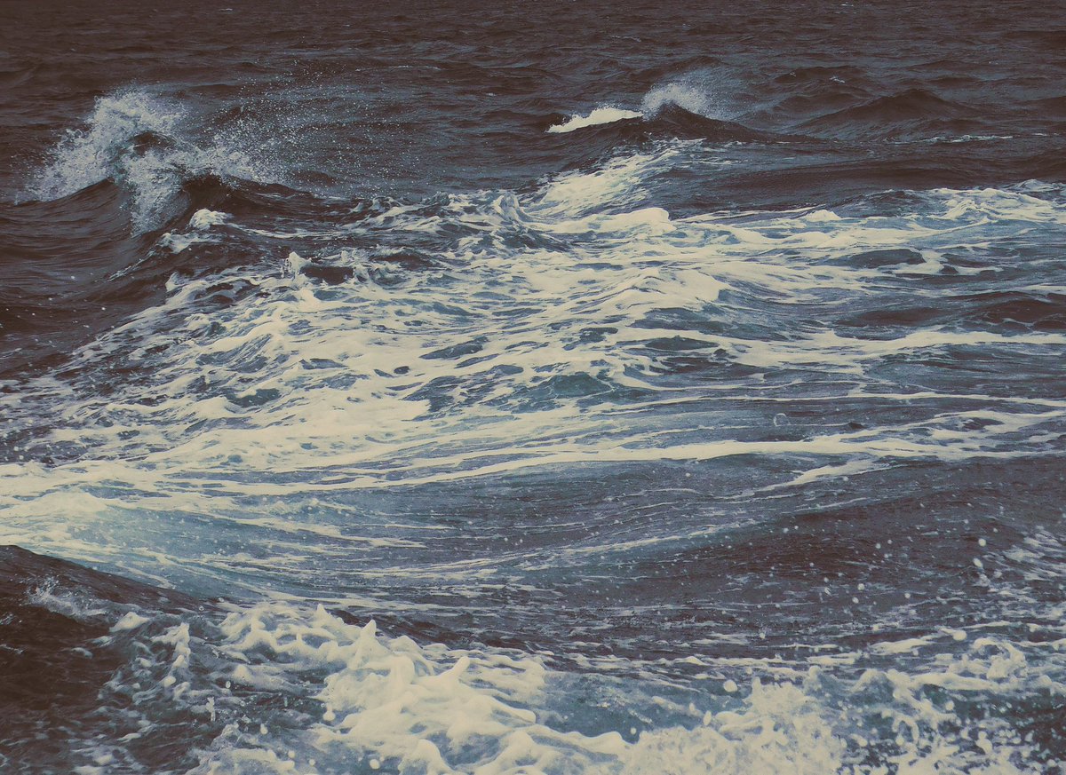 vivrelamer's tweet image. it felt like a cold day. the rain falling softly as i stood in this boat, mesmerized by the dancing waves