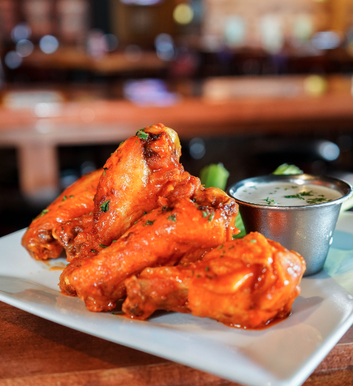 Hey, folks!👋 Get ready to spice things up! 🔥 Wing Wednesday is HERE! 🍗 At your beloved downtown hangout, we're serving our trademark classic wings at half price! 💸 Every Wednesday is a feast day, where you can devour to your heart's content! See you soon. 💪