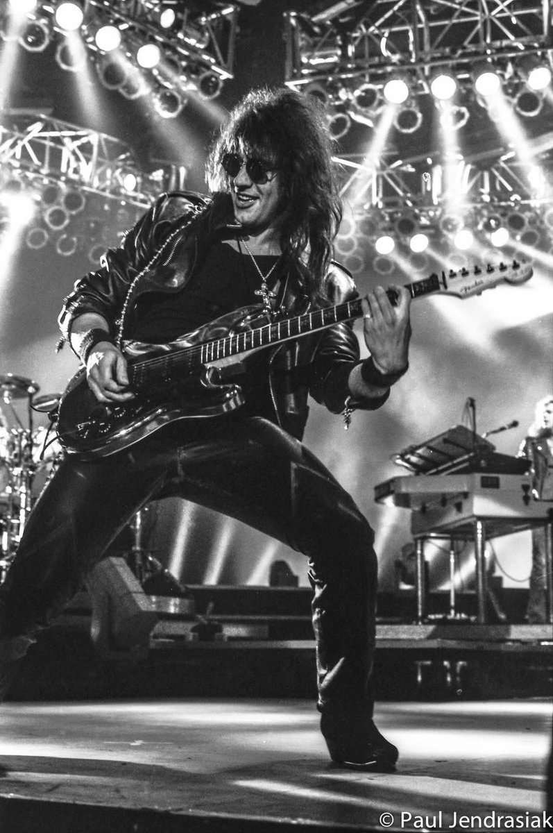 Thought I'd revisit the shots I took of Bon Jovi in 1993 when they were on the Keep the Faith tour.

This is one of my favorites I took of Richie Sambora flashing a smile as he plays his guitar.

I've got some more shots of the show. If you're a fan of Bon Jovi and you'd like to