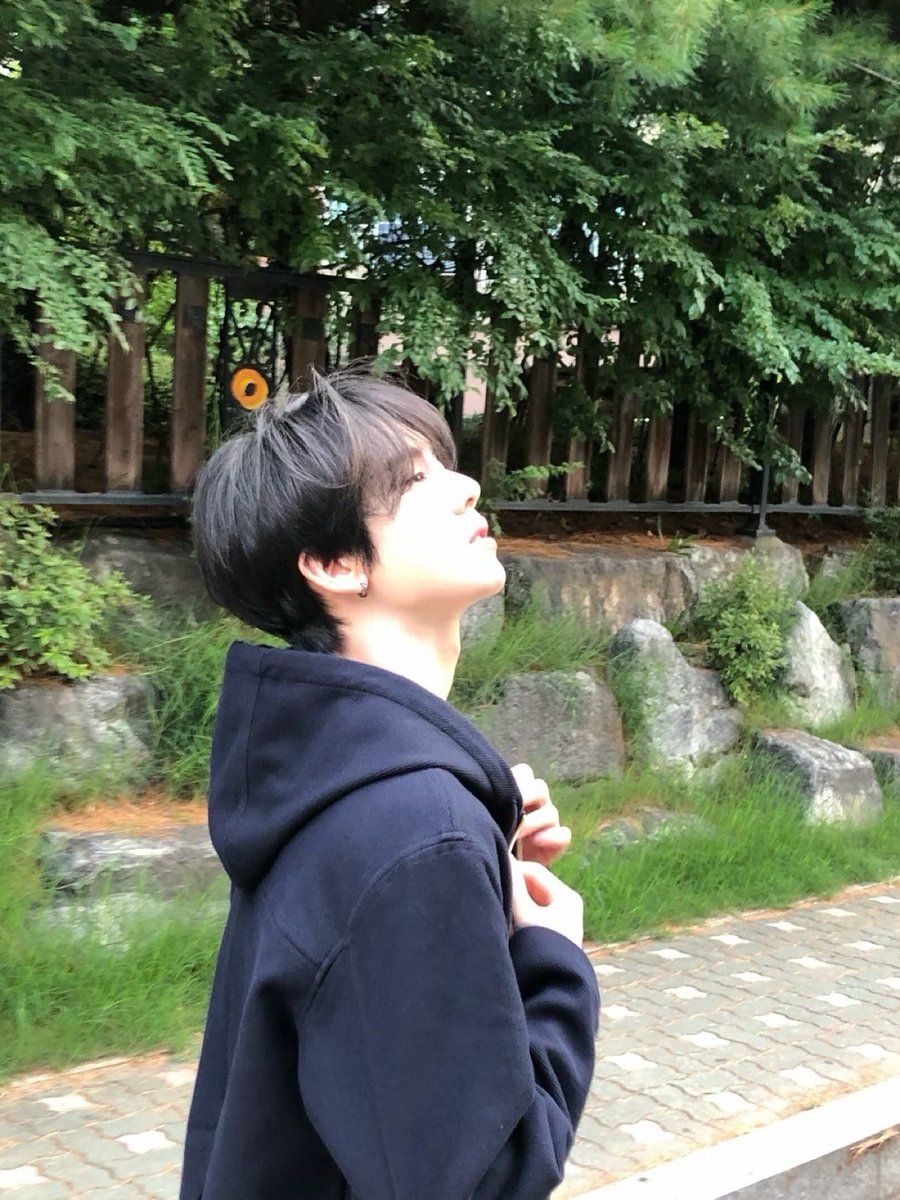 Black hoodie, golden-hour glow—because ‘boyfriend material’ isn’t a vibe, it’s a fact.