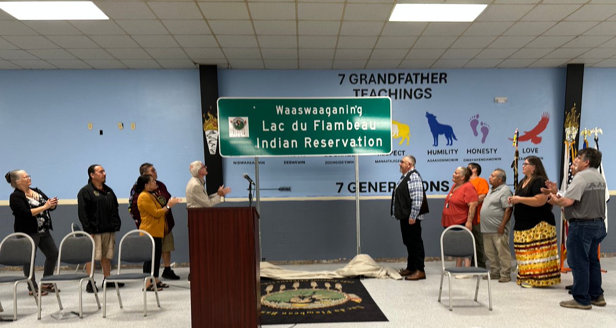 WisconsinDOT's tweet image. Secretary Boardman joined @GovEvers and Lac du Flambeau President John Johnson Sr. today to celebrate the newest set of dual-language highway signs, which identify Lac du Flambeau’s Tribal boundaries and four lakes in both the Ojibwe and English languages. content.govdelivery.com/accounts/WIGOV…