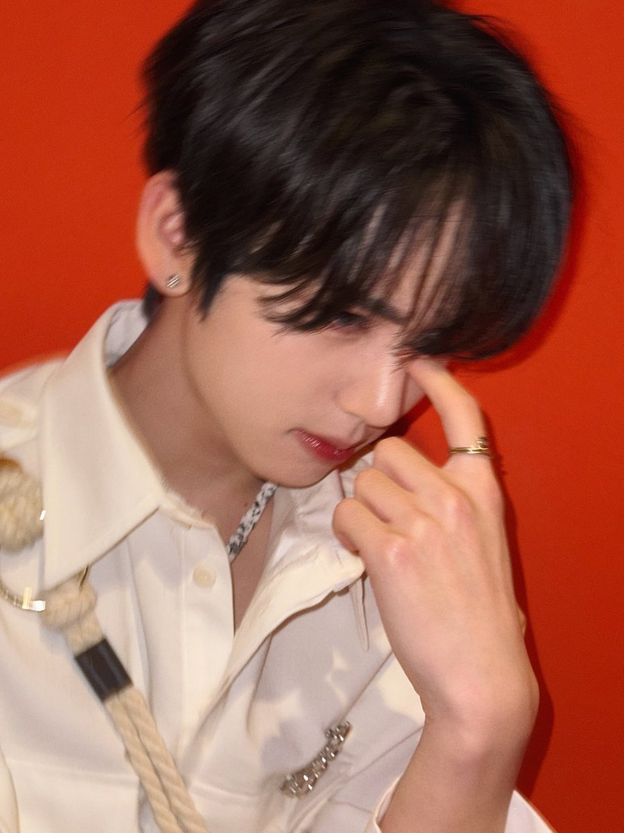 The shirt says ‘mature.’ The smile says ‘still baby.’ The hyungs say ‘give it up.’