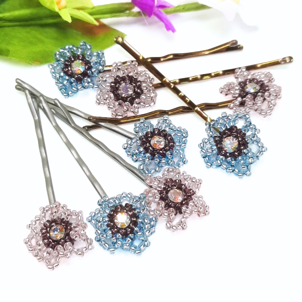 Pretty hair grips with a vintage vibe to them. Pink and blue beaded flowers with a sparkly crystal centre and a choice of blonde or grey grips to suit your hair colour thebritishcrafthouse.co.uk/product/vintag… #earlybiz #shopindie #mhhsbd