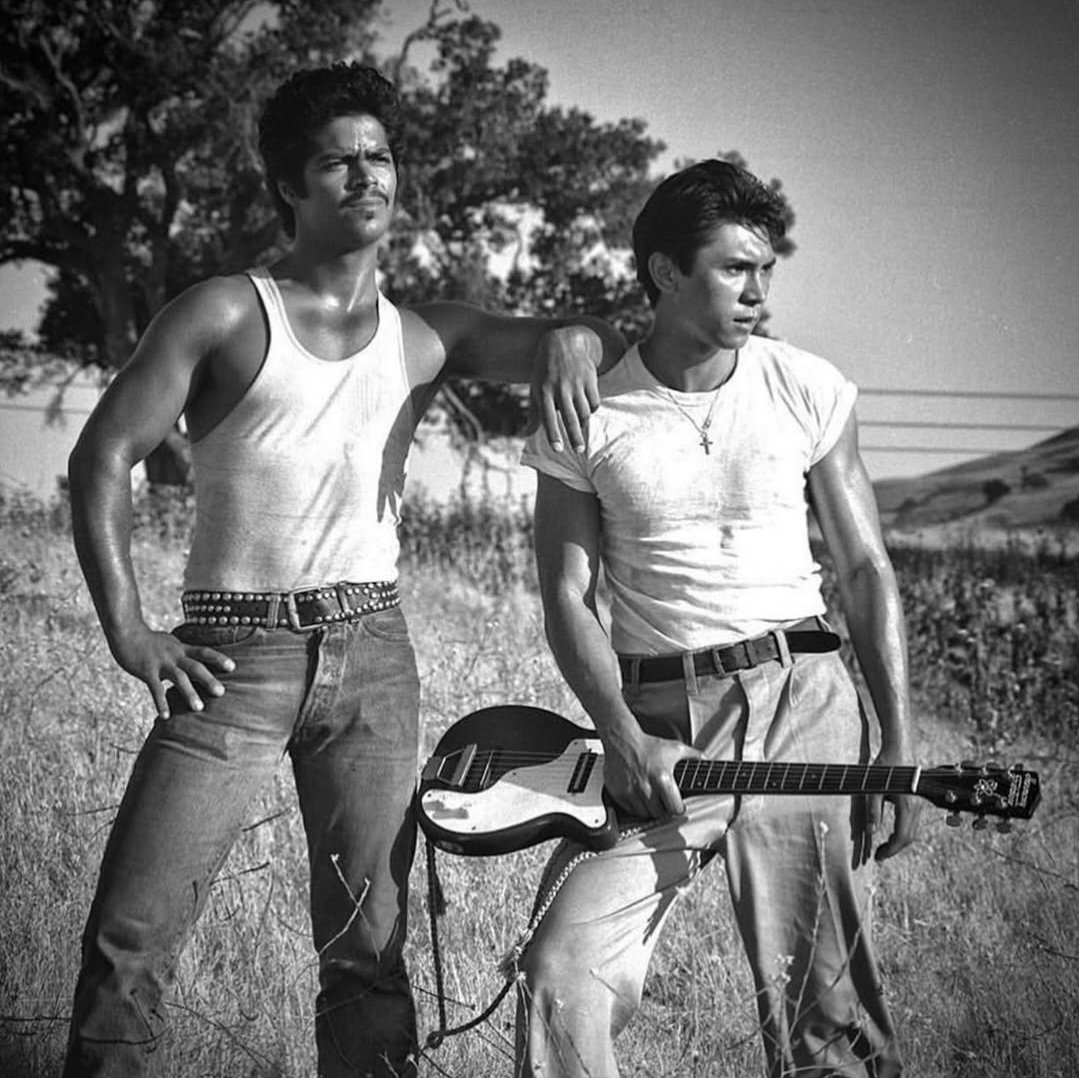 Lou Diamond Phillips as Ritchie Valens and Esai Morales as Bob on the set of La Bamba. 

Pic by Merrick Morton
La Bamba was released on this day, 1987.