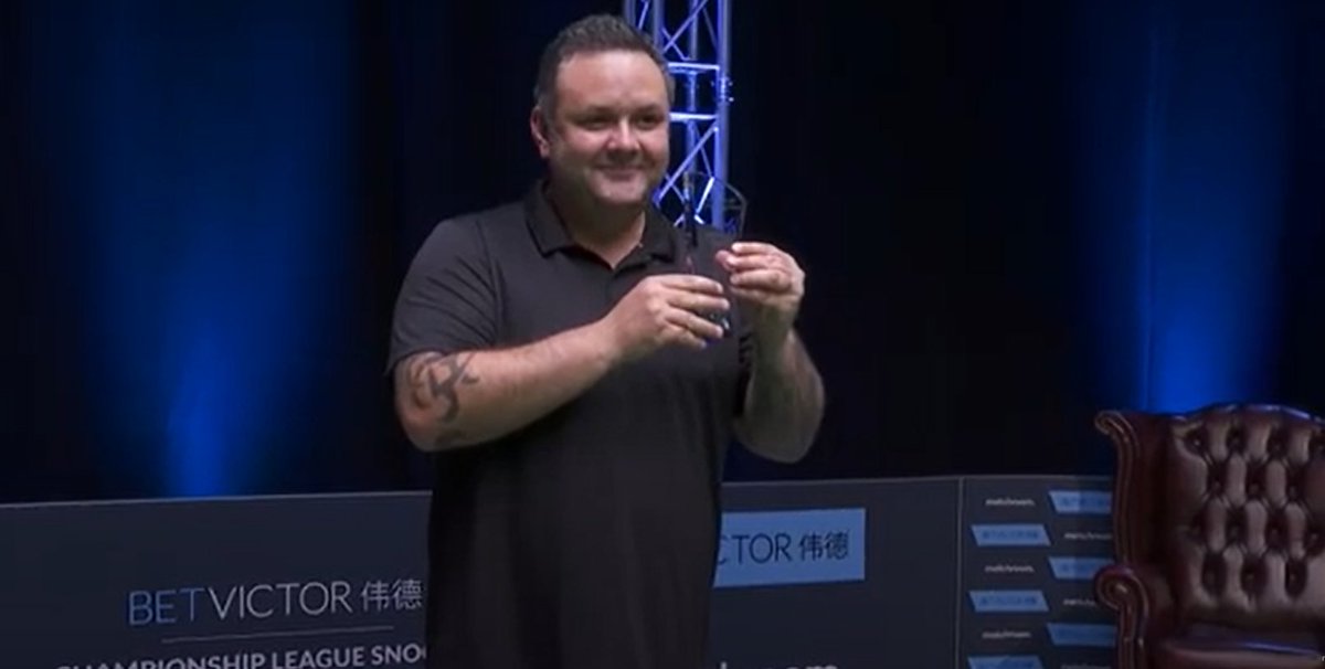 Really not sure about a trophy that you can't actually see.

Looks like Maguire has been asked to mime this.