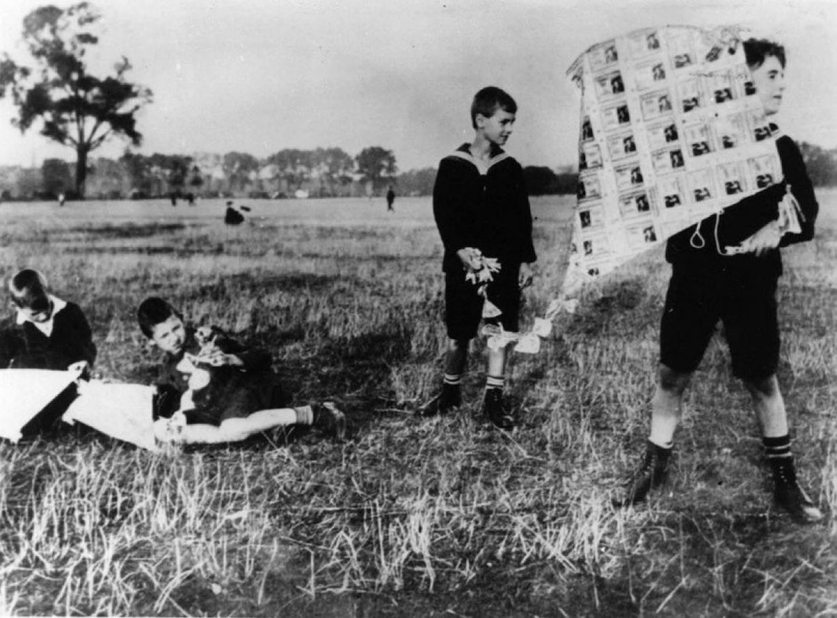 German kids flying a kite in 1923, made from worthless money during hyperinflation. In 1922, a loaf of bread in Berlin cost approximately 160 Marks. One year later, at the end of 1923, that same loaf of bread cost 200,000,000,000 Marks.