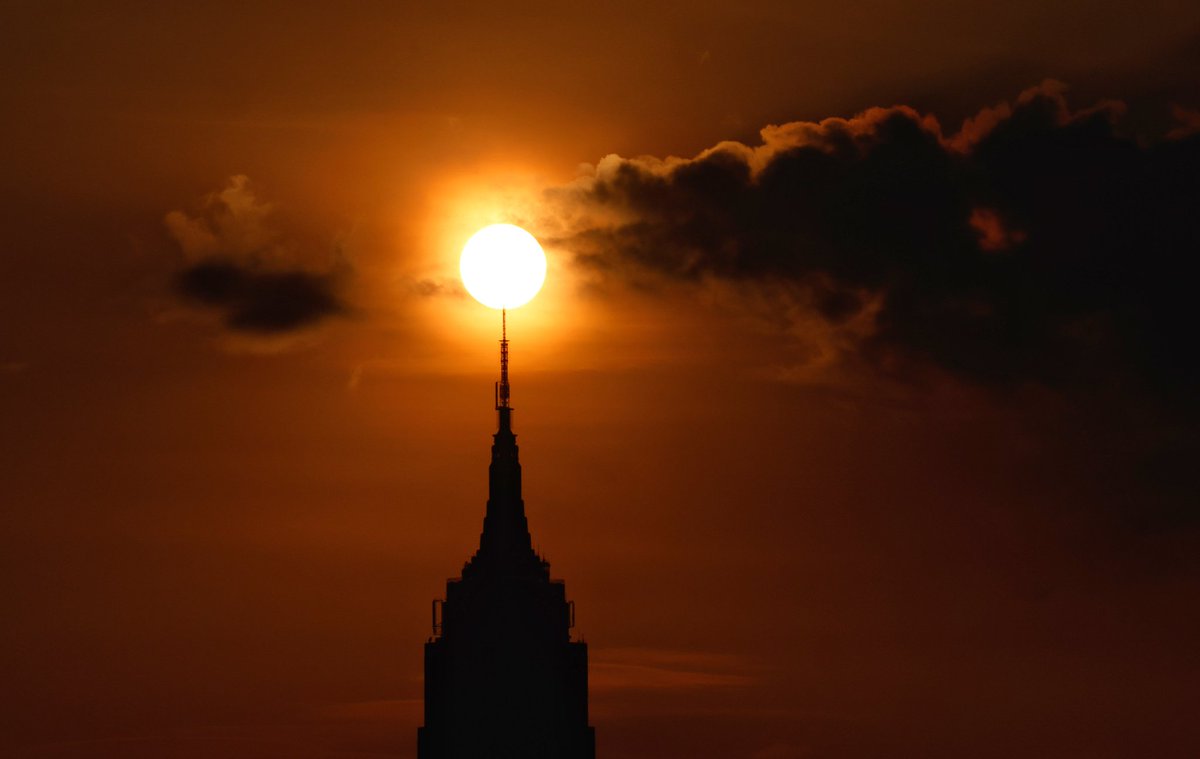 The sun rising behind the Empire State Building in New York City, Thursday morning #newyorkcity #nyc #newyork @empirestatebldg #sunrise
