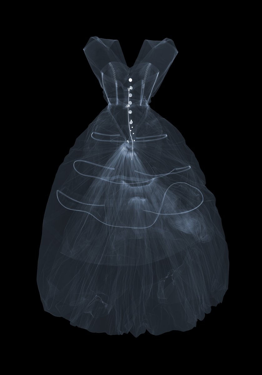 V_and_A's tweet image. The most ordered object at V&A East Storehouse: an X-ray of Balenciaga’s 1954 balloon-hem dress. Though known for avoiding corsetry, the image reveals hidden boning and hooping, showing his innovative approach to structure and silhouette. Beauty meets science.