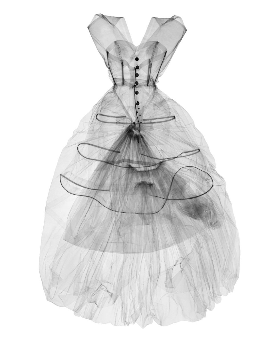 V_and_A's tweet image. The most ordered object at V&A East Storehouse: an X-ray of Balenciaga’s 1954 balloon-hem dress. Though known for avoiding corsetry, the image reveals hidden boning and hooping, showing his innovative approach to structure and silhouette. Beauty meets science.