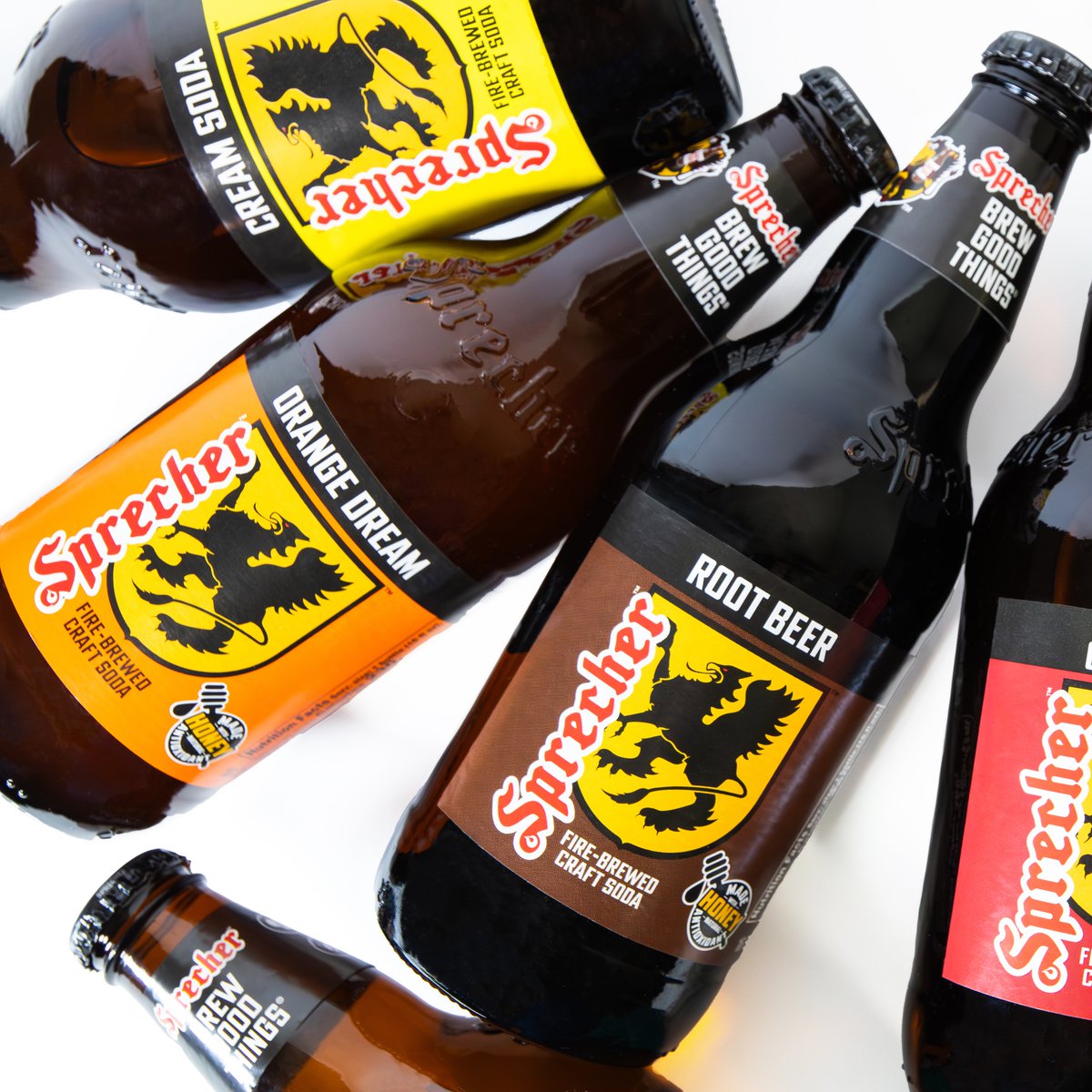 The Sprecher Root Beer bottle has had many faces. Originally, Sprecher Root Beer was served in recycled Pabst bottles with a flashy gold foil top. Soon after, it became popular enough to be fitted into it’s own 16oz embossed glass bottle with Rooty the Griffin front and center.