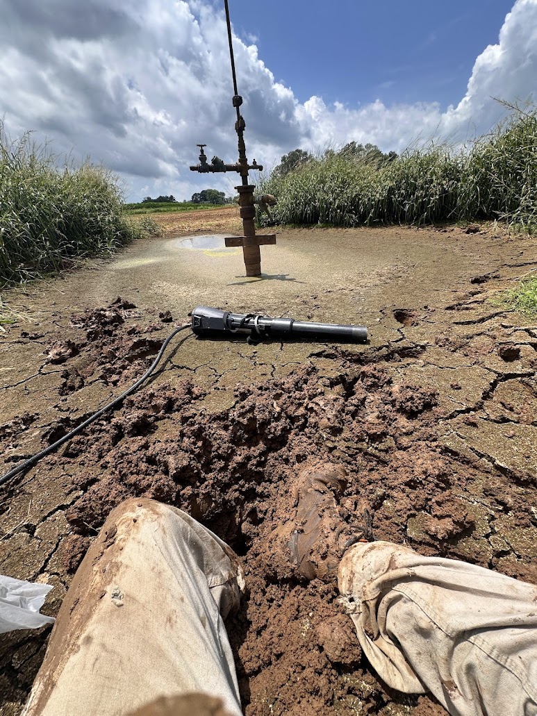 Mudcracks ≠ dry soil

This Barren County well has been underwater for the past few months, making it impossible to access for measurements. So when geologists Deron Zierer and Zach Walton saw it was finally “dry,” they may have gotten a little too excited, stepped in, and