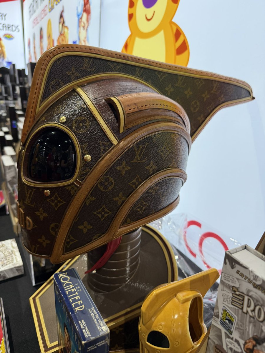Stop by Saturday Morning Cards’ booth at 5633 and check out their Louis Vuitton Rocketeer helmet.
