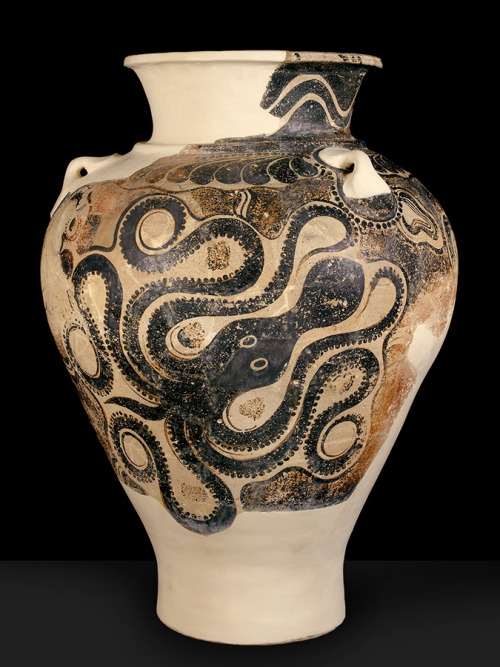 A large Late Minoan II terracotta storage jar (pithos) from Knossos, Crete (c. 1450–1400 BC), with three handles and a painted octopus motif, exemplifying the fusion of Minoan and Mycenaean styles in form and decoration. 

Standing 75 cm tall, the three-handled clay jar looms