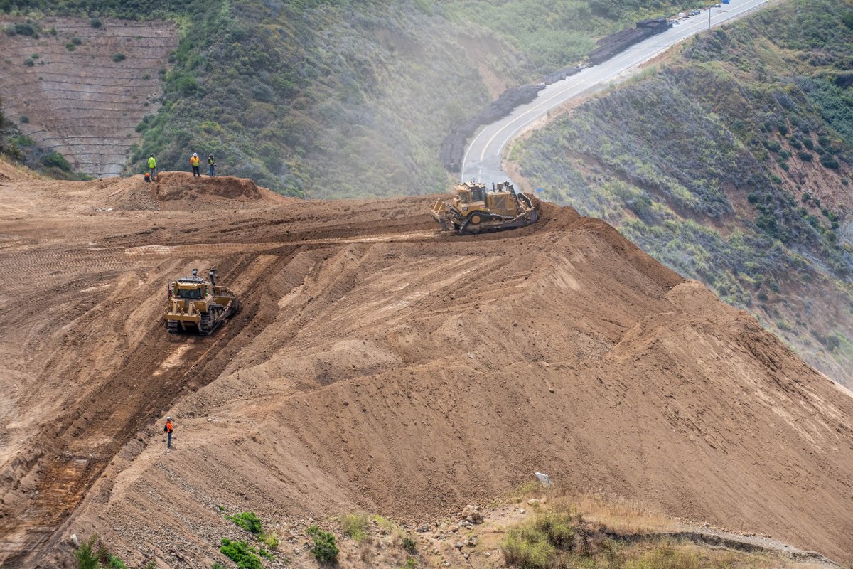 CaltransD5's tweet image. Crews at work 7 days a week and extended hours at Regent’s Slide. Full-scale excavation resumed mid-July utilizing both conventional and remote-controlled equipment. Crews continue to install shear dowels in the cut slope to provide immediate and long-term slope reinforcement.