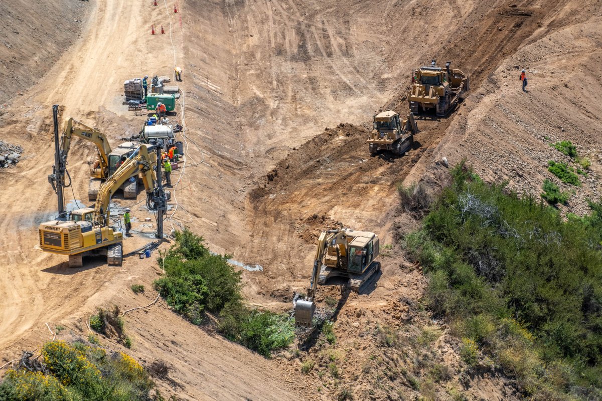 CaltransD5's tweet image. Crews at work 7 days a week and extended hours at Regent’s Slide. Full-scale excavation resumed mid-July utilizing both conventional and remote-controlled equipment. Crews continue to install shear dowels in the cut slope to provide immediate and long-term slope reinforcement.