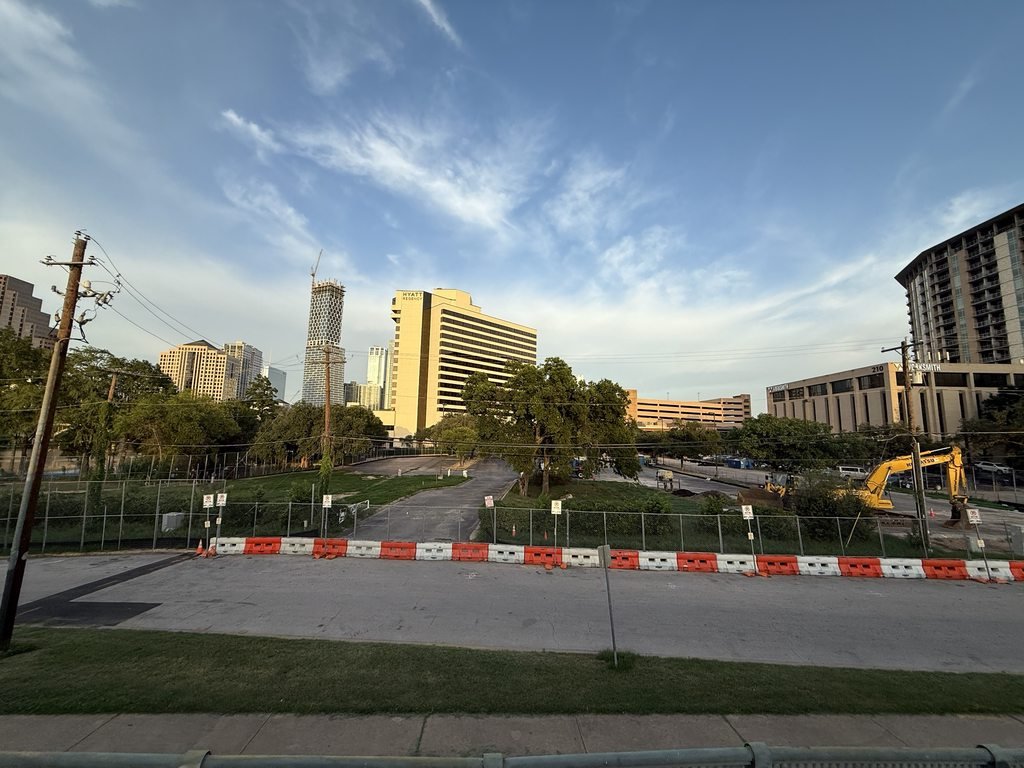 TheATX1's tweet image. The excavator on the One Ladybird Lake residential project site has not seen much action since arriving on site a couple weeks ago. Credit: gillynova