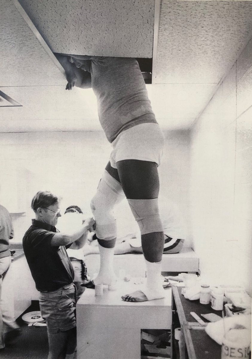 _petethetrainer's tweet image. With @NFL camps opening this week, sharing a favorite "in the trenches" photo from the home office. @NATA1950 Hall of Famer and long time, legendary @49ers athletic trainer Lindsy McLean at work! Work with the space and tools you are provided. 💪