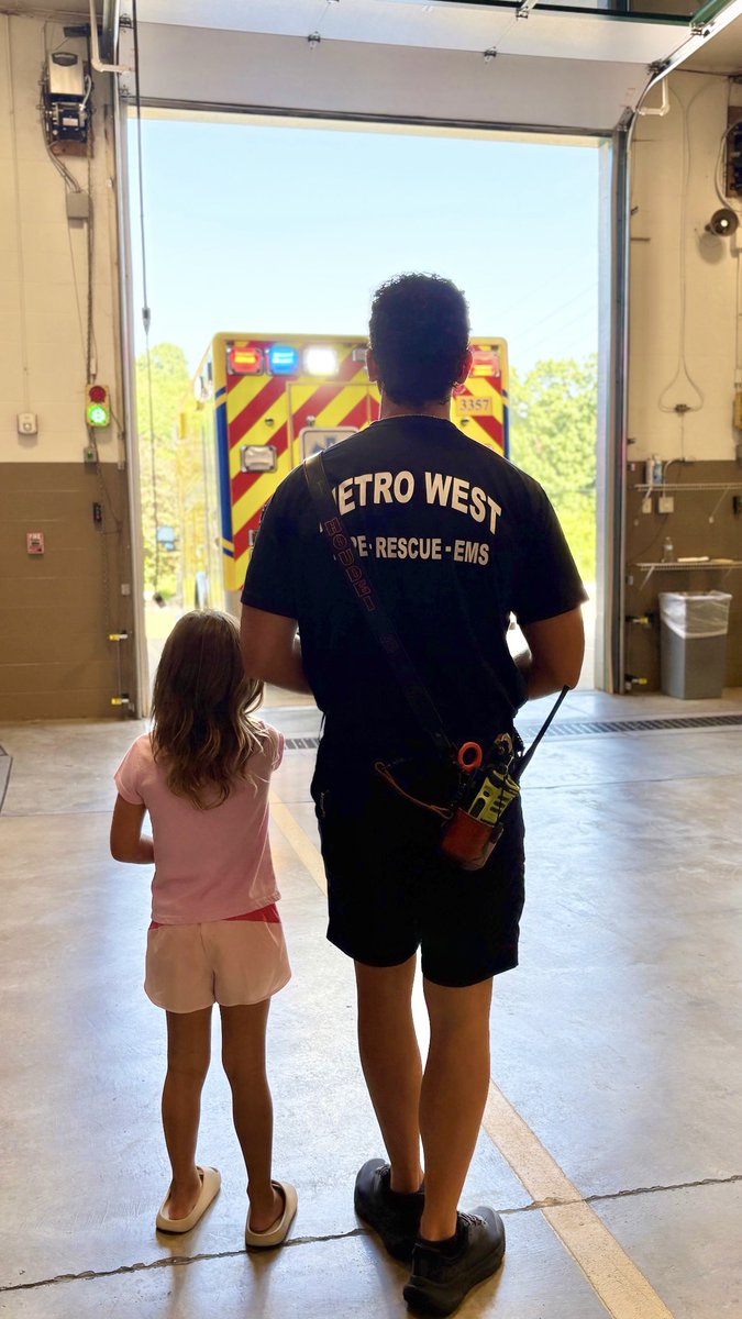 Moments like this remind us of who we come home to. Firefighter/Paramedic Justin Houdei and his daughter, Charlotte, watch an ambulance leave Station 5 in Wildwood for an EMS call. The perfect image of service and family. #YourLifeOurMission