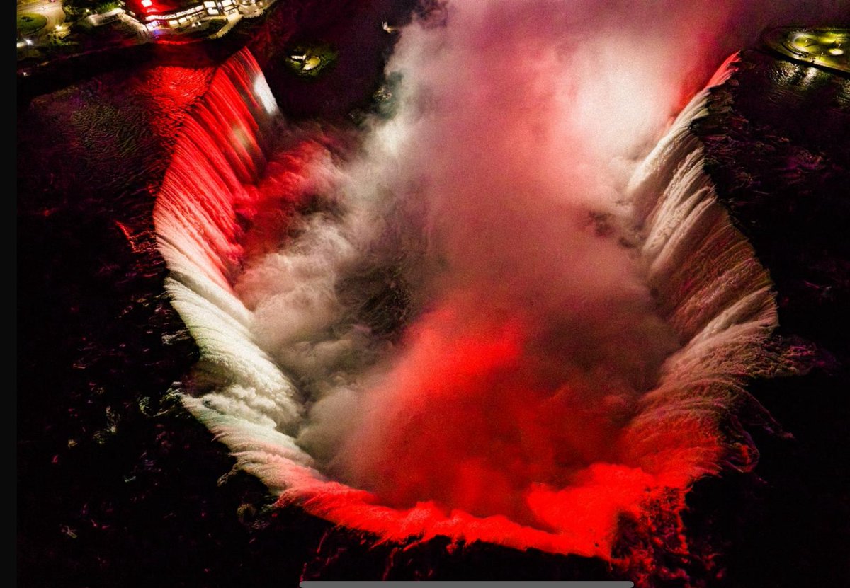 AndyMitten's tweet image. Drone footage of Niagara Falls last night. Following this trial run organised by the @NiagaraMUFC the Rivers Irwell and Mersey in north west England will be permanently turned red, white and black