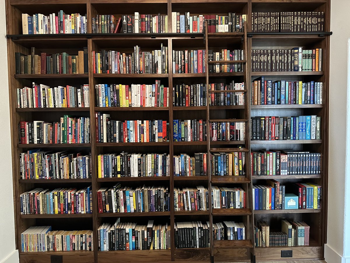 ID_AA_Carmack's tweet image. Trista turned the formal dining room into a library for me at our new house, and I love it!
We still have separate shelving for paperbacks, magazines, and graphic novels, and a few more bookshelves in my Fortress of Solitude, but this is the most books I have ever had shelved in…