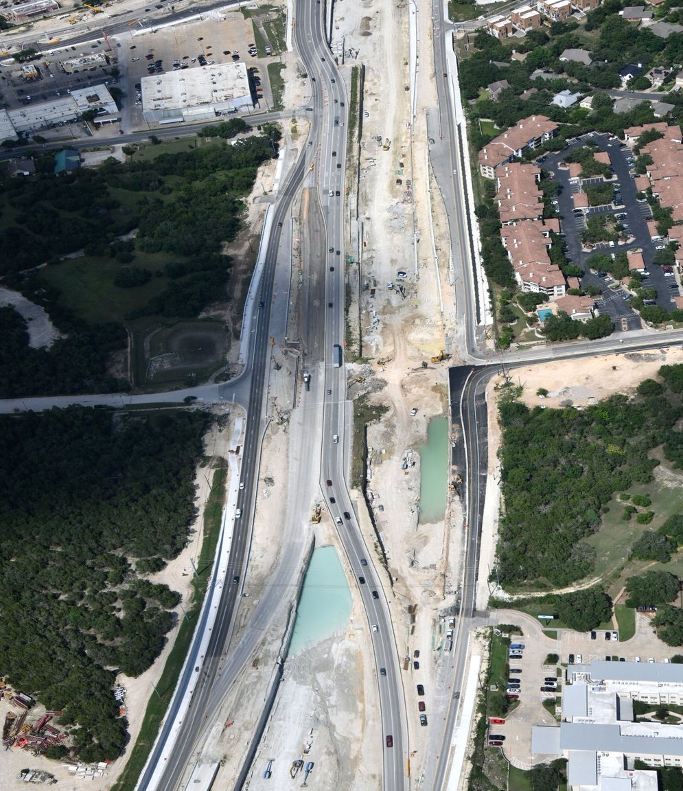 OakHillParkway's tweet photo. With cross-street access closed at Convict Hill Road, crews are hard at work excavating for the Convict Hill bridge. This will be the project’s final cross-street bridge. #buildingup #mobility 
(Photo credit: AeroPhoto) https://t.co/VYUiFyjxyZ