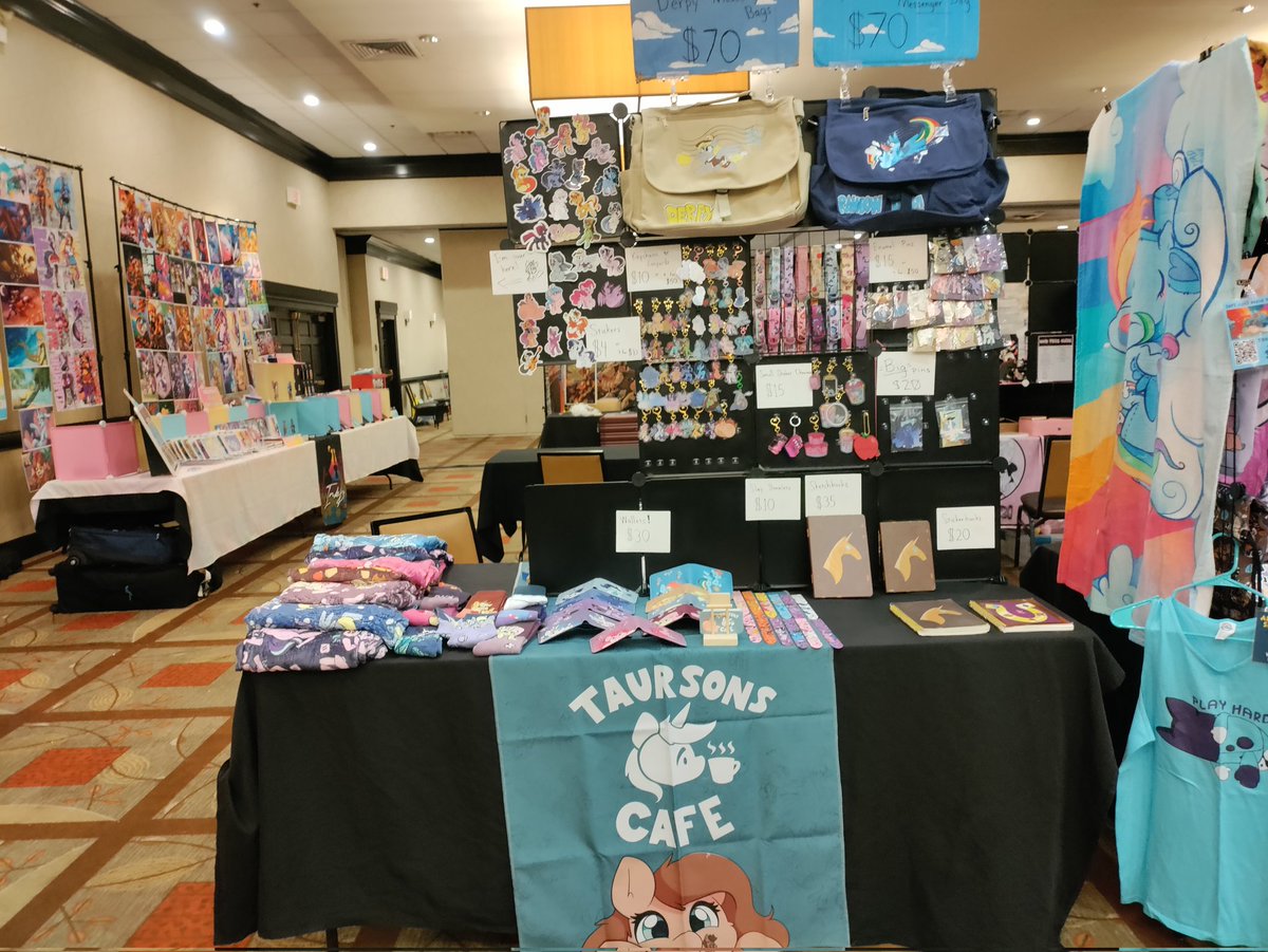 Taurson's tweet image. Heckin all ready for @TrotCon come on by and see my stuff, got some new jammies and socks on for sale but limited ^^"