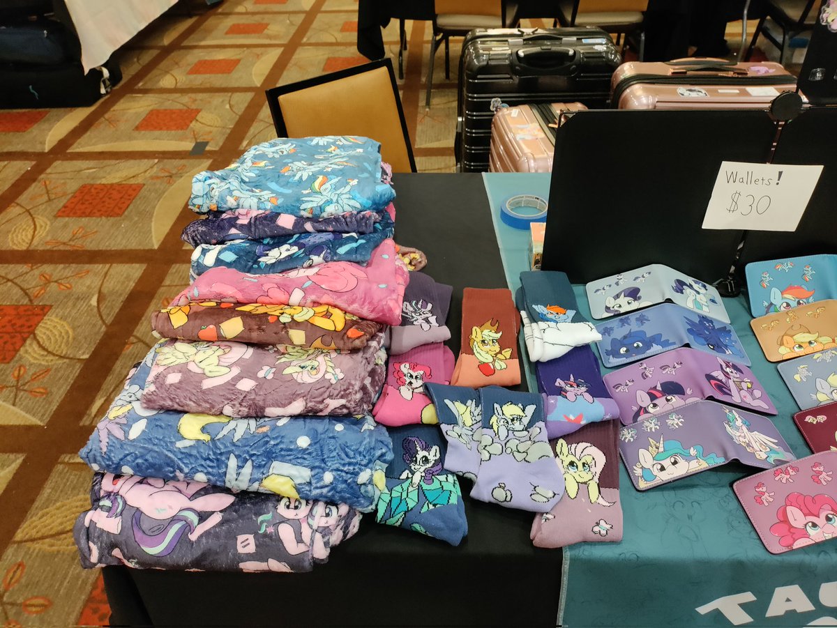 Taurson's tweet image. Heckin all ready for @TrotCon come on by and see my stuff, got some new jammies and socks on for sale but limited ^^"