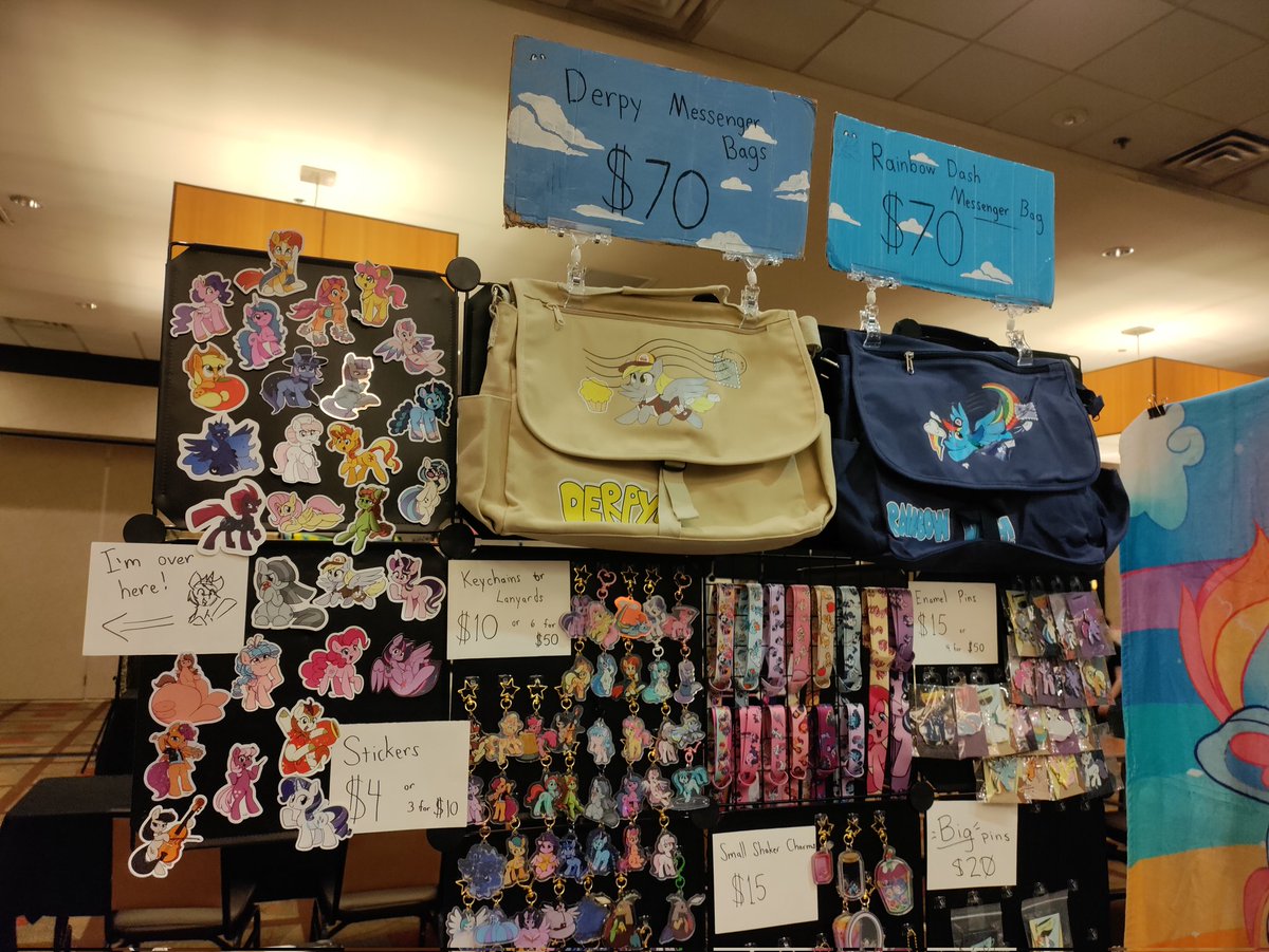 Taurson's tweet image. Heckin all ready for @TrotCon come on by and see my stuff, got some new jammies and socks on for sale but limited ^^"