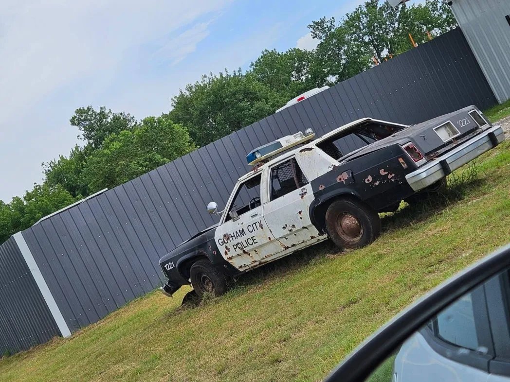 HoustonSixFlags's tweet image. A Batman the Escape Police Car Sits. in Texas on the Side of the Road