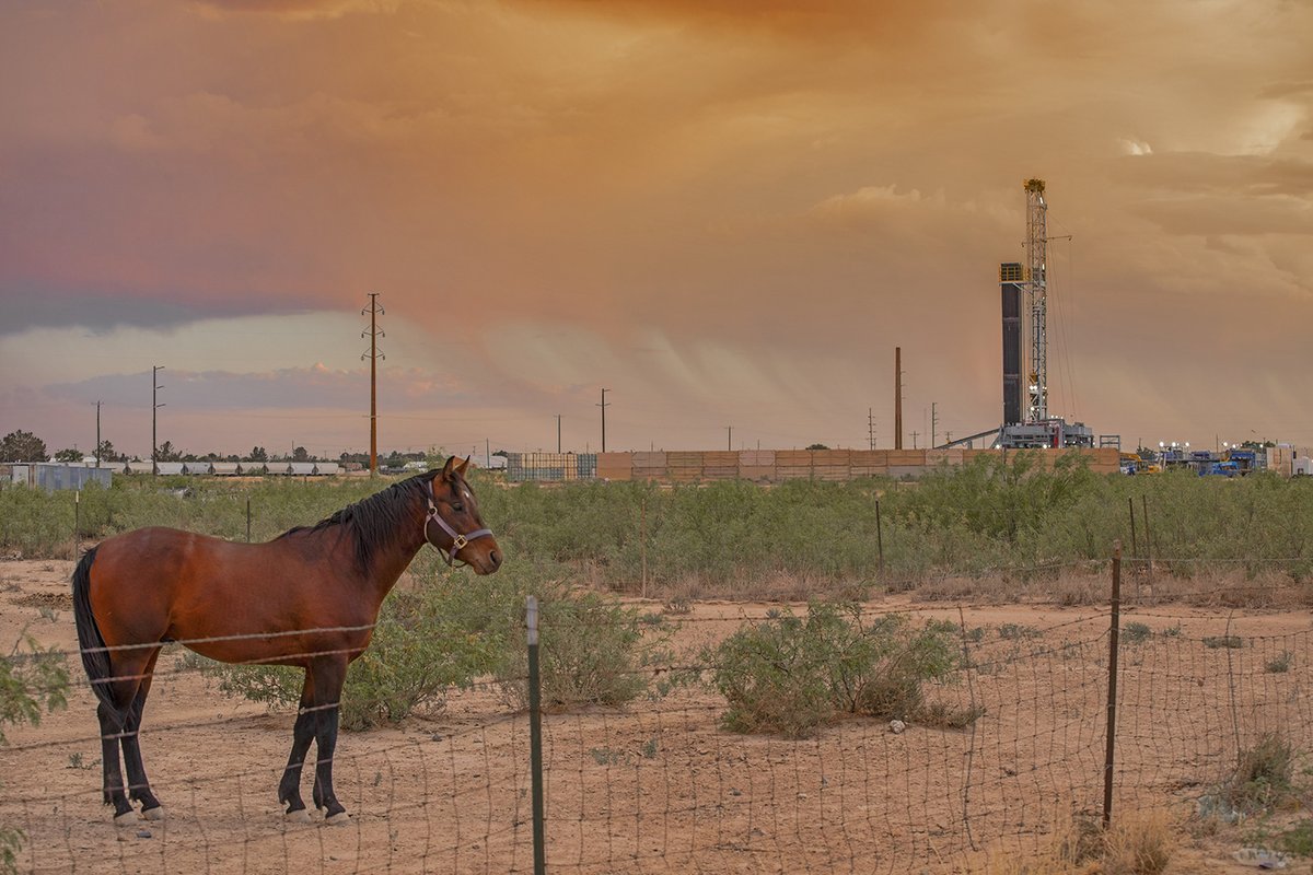 My eye is always attracted to incongruities. I was in Pecos on a day in which the dust was flying, driven by steady gusty 50-60 mph winds. In the late afternoon the wind died down considerably but there were places where the rain was falling. As sundown approached the light took