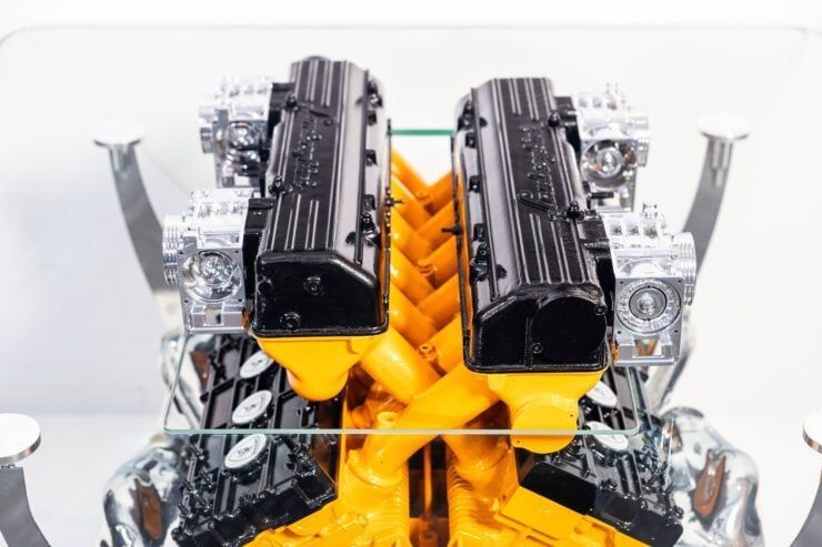 Silodrome's tweet image. This is a coffee table made from a real Lamborghini Murcielago V12. It has a half-inch-thick tempered glass table top with a cutout center section to allow the intake to rise through the middle.
buff.ly/G2TH2eO