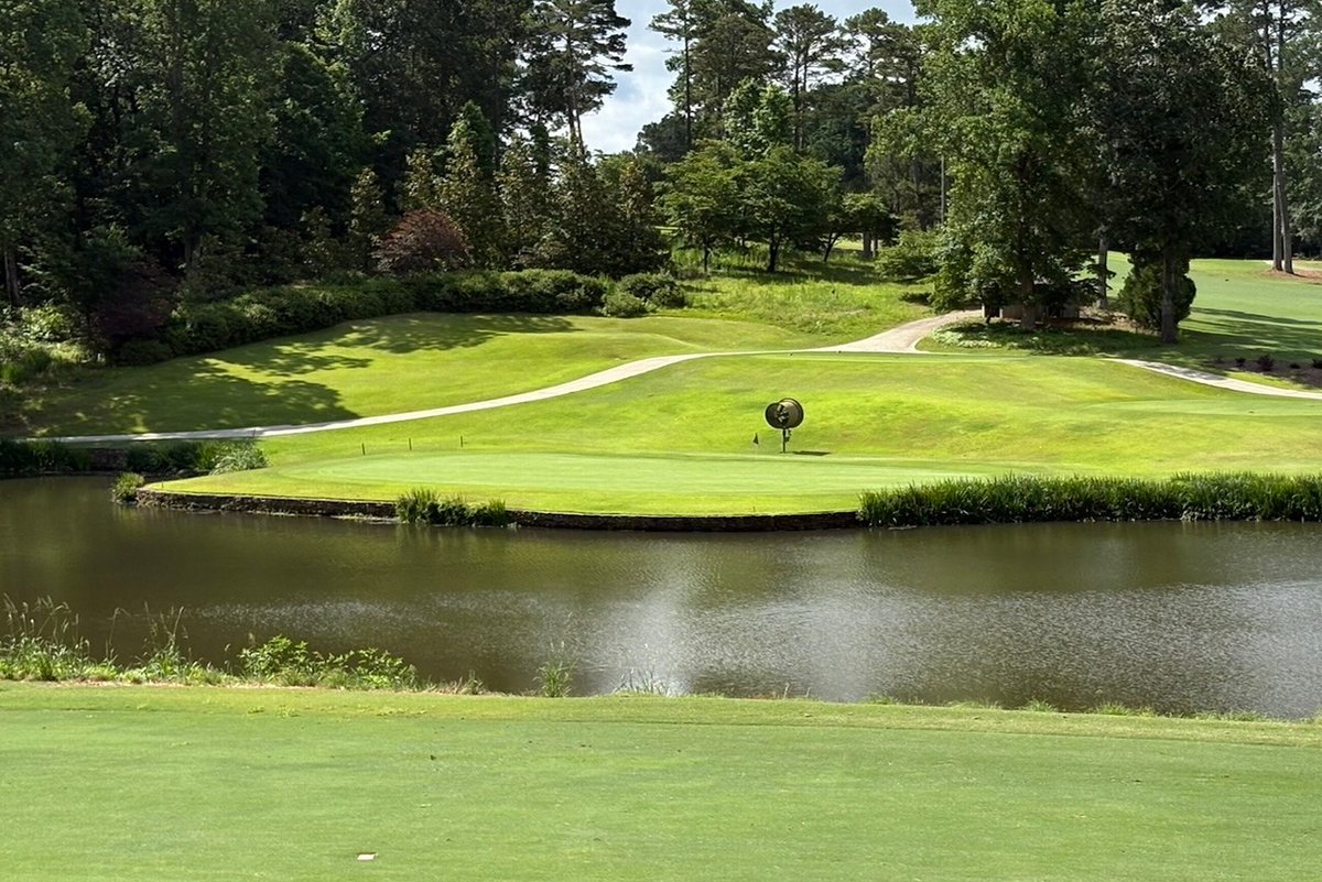 ✨Happy Flashback Friday✨ This week we're diving into Hole #12, where the pond is picture perfect for your camera but a nightmare for your approach shot. The choice remains: lay up or chunk it into the water?