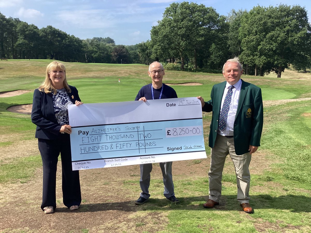 Retiring Sandiway Captains, Janet Carter and Graham Sayers passing a cheque for £8,250 to Rob Catlow of <a href="/alzheimerssoc/">Alzheimer's Society</a>  They raised this amazing amount in a series of events throughout their year in office. Rob said: "Wow,  I would like to thank the Club and all the Members for
