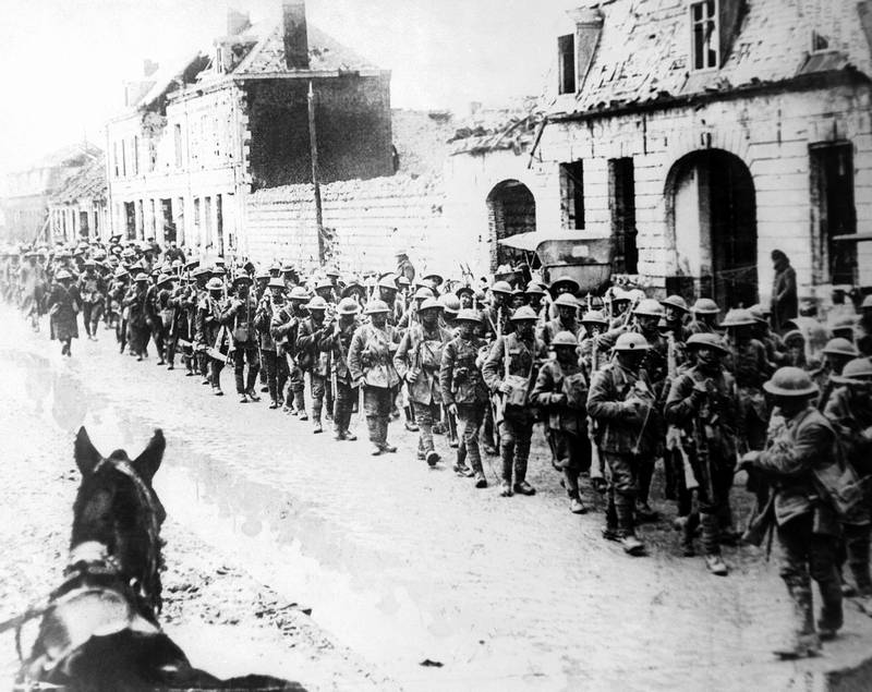 WW1IEPER1917's tweet image. British soldiers returning in formation to Ypres, Belgium 1917.
