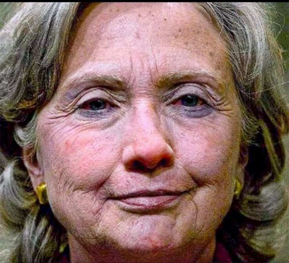 TrumpVVon's tweet image. Describe Hillary Clinton using only one word.