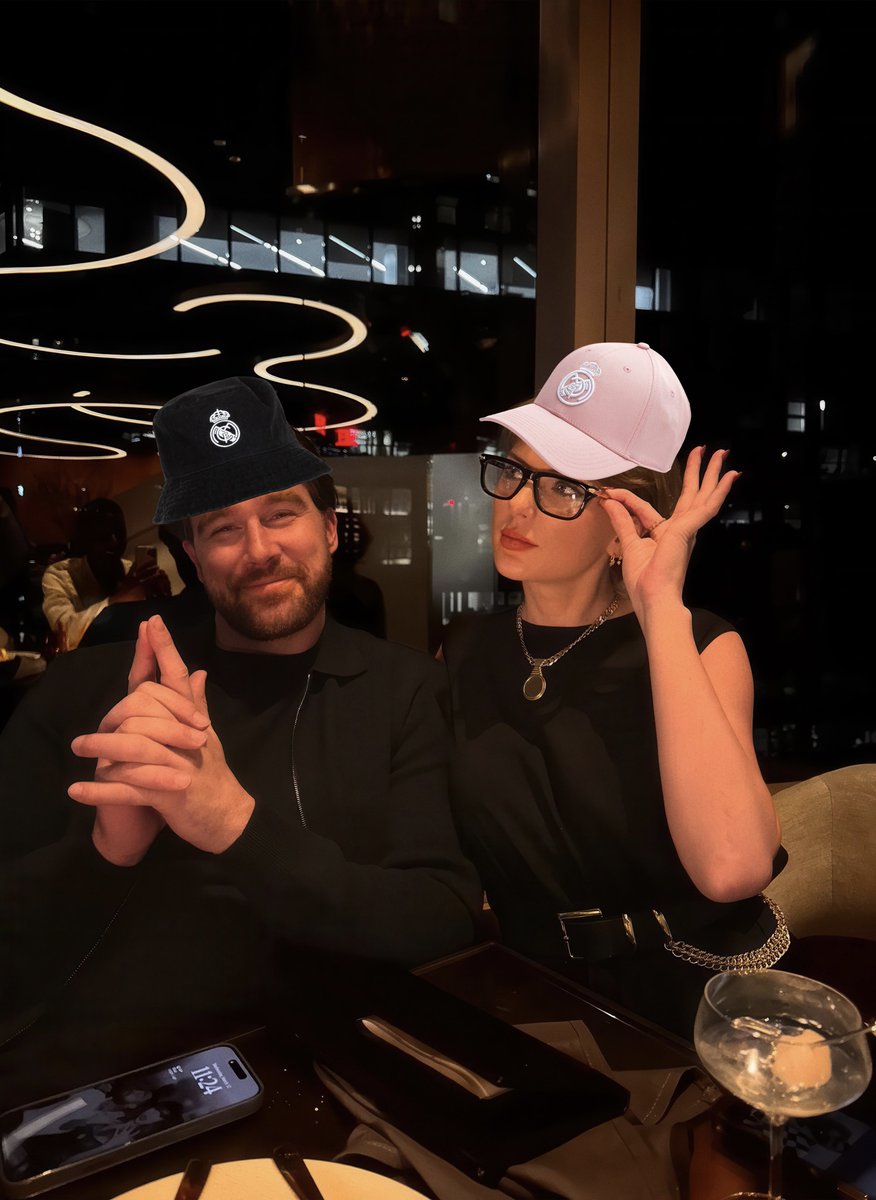 bellikr8s's tweet image. Taylor Swift and Travis Kelce with Real Madrid hats