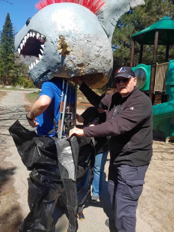 I saw some posts claiming the Kaiju Glam Metal Shark was paper or cardboard. It was not. It was large and heavy.  <a href="/johnnehill/">John N.E. Hill</a> had quite a job wearing it