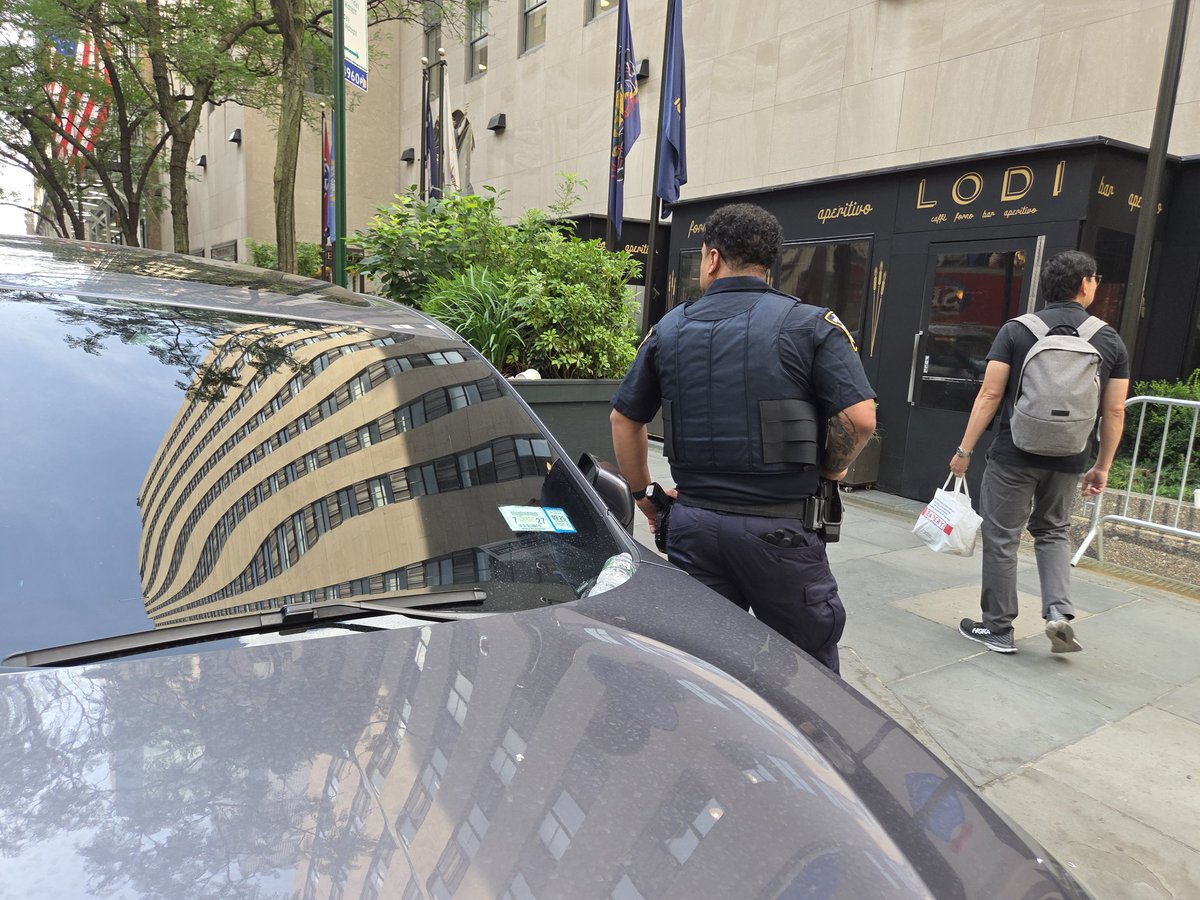 placardabuse's tweet image. Presumably the illegally parked car with the @NYPDnews placard that was illegally transferred from a different vehicle belonged to the off-duty cop that was leaning on it while working a "paid detail" side job for @nbc.
#PlacardCorruption